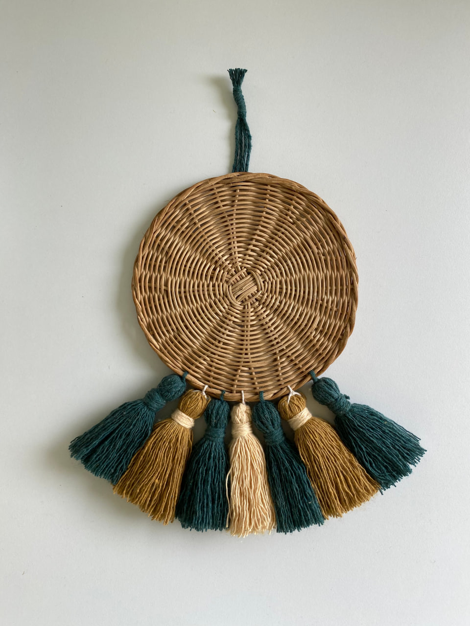 braided-circle-with-beige-green-tassels-main